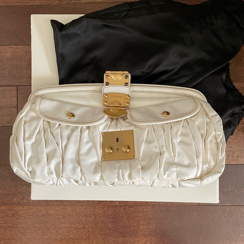 COPY - Large off-white leather Miumiu clutch- this was sold and then returned.